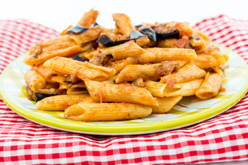 Spaghetti with aubergine and tomato on a the table