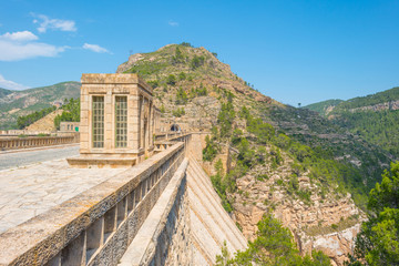 Fototapeta premium Dam in a vally in sunlight