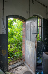 open door / Opened door of an uninhabited, dilapidated house