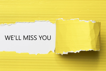 The text We'll Miss You appearing behind torn paper