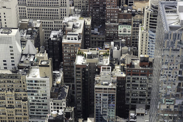 View of rooftops on residential and business buildings in midtown Manhattan