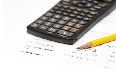 calculator and pencil white background