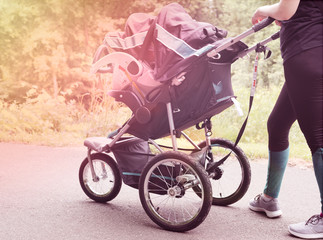 female pushing stroller