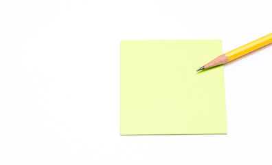 pencil and post it paper on white background