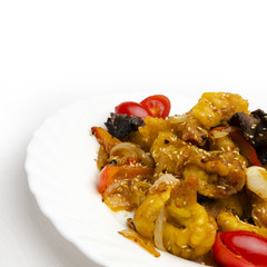 close up sweet and sour chicken on a plate isolated on a white background.