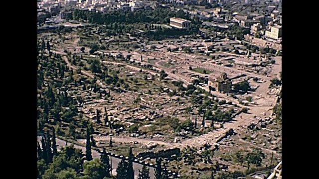 Ancient Athens Agora aerial view from Acropolis hill with close up on ancient Greek Temple of Efesto ruins. Restored historical 70s archival footage on 1972 in Greece.