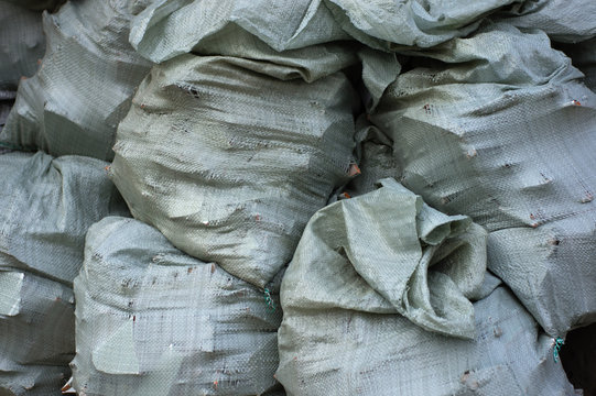 A pile of sacks with construction debris, carrying out repairs