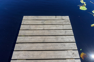 Fototapeta premium reflection of clouds in the lake with boardwalk