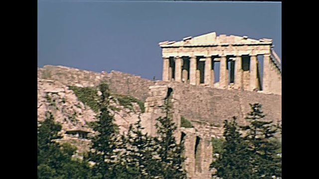 Ground view from the road of the Parthenon Ancient Greek temple at the Acropolis of Athens in Greece. Dedicated to Athena goddess. historical 70s archival footage on 1972 in Greece.
