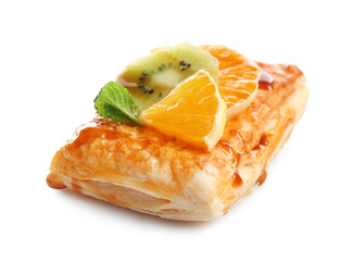 Delicious puff pastry with fruits on white background