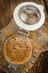 Wooden table with Sweet Mustard (selective focus)