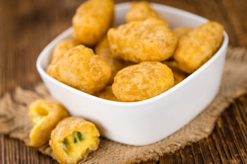 Cheese Nuggets (with Chilis) (selective focus, close-up shot)