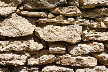 Fototapeta premium Wall of different sized rocks. Background.