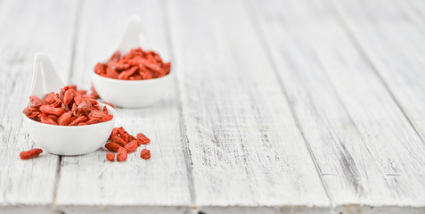 Goji Berries (dried) on vintage wooden background
