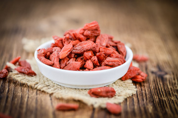 Goji Berries (dried) on vintage wooden background