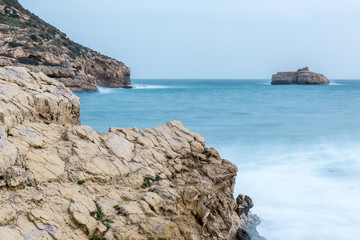 Fototapeta na wymiar The small island of cala Portixol in Alicante