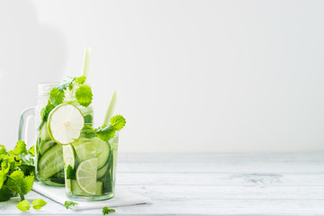 Refreshing drink with cucumber, lime, mint. Copy space