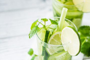 Refreshing drink with cucumber, lime, mint. Close up