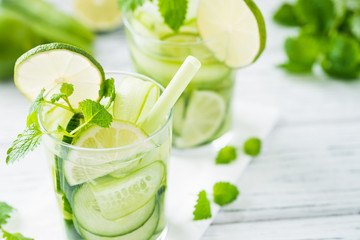 Refreshing drink with cucumber, lime, mint. Close up