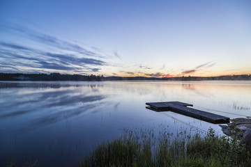 Beautiful midsummer night in Finland next to lake