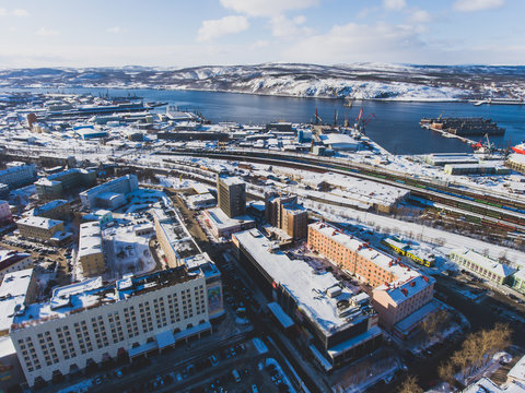 Beautiful aerial air winter vibrant view of Murmansk, Russia, a port city and the administrative center of Murmansk Oblast, Kola peninsula, Kola Bay, shot from quadcopter drone
