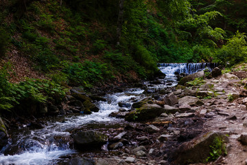 Beautiful landscape rapids on a mountains river in sunlight. Filtered image: colorful effect.