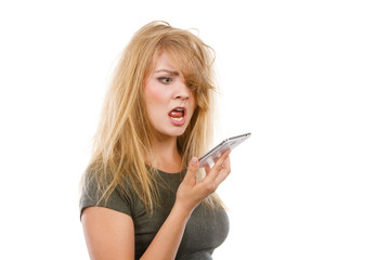 Angry young woman talking on phone