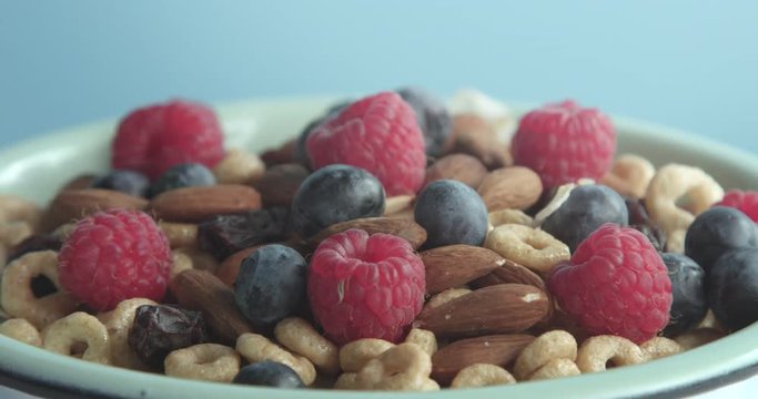 bowl with a berries and almond turning on its axis