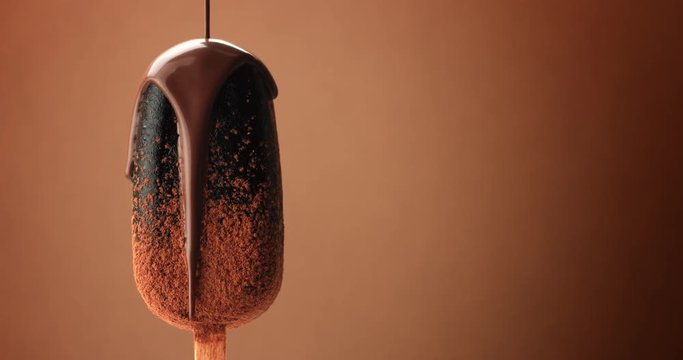 chocolate ice cream on a stick and liquid chocolate covered it. Different chocolate textures