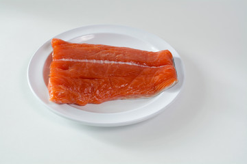 Raw King  Salmon lying on white place, isolated on white background