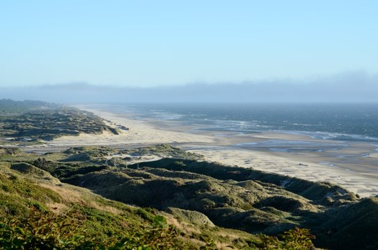 View of a long beach, dunes and coastline looking south towards Florence on the Oregon Central coast