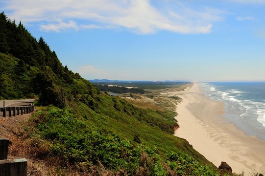 View of a long beach and coastline looking towards Florence on the Oregon Central coast, along Highway 101