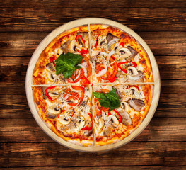Pizza with seafood on the  wooden table. Visit my page. You will be able to find an image for every pizza sold in your cafe or restaurant.  