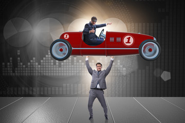 Businessman lifting sports car in power concept