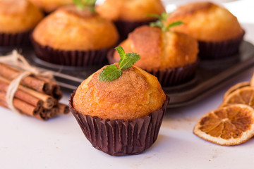 Homemade muffins with spices on a white background