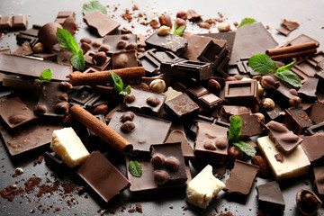 Heap of broken chocolate pieces on table