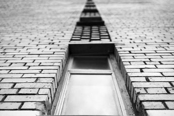 Obraz premium Black and white perspective brick building city background