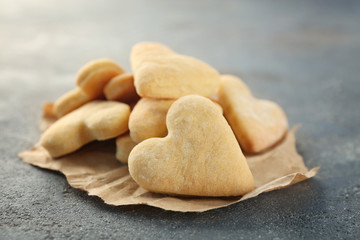Fototapeta na wymiar Butter cookies in shape of heart on table