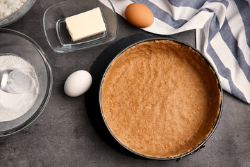 Ingredients for cheesecake on kitchen table