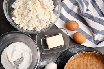 Ingredients for cheesecake on kitchen table