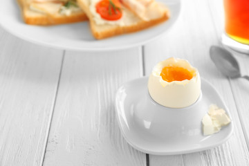 Tasty boiled egg for breakfast on table