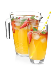 Jug and glass with delicious lemonade on white background