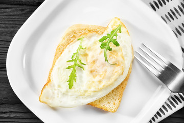 Delicious over hard egg and bread slice on plate