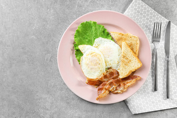 Delicious breakfast with over hard eggs on kitchen table