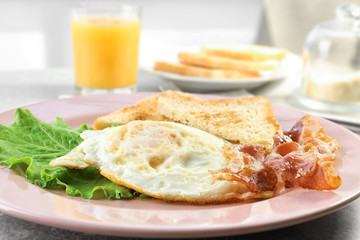 Delicious breakfast with over hard eggs, closeup