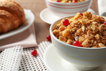 Breakfast cereal with cranberries and sunflower seeds on table