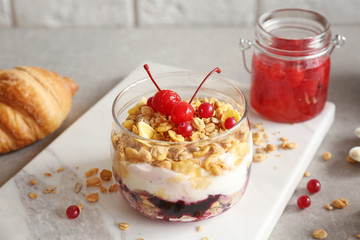 Breakfast cereal with berries and yogurt on table