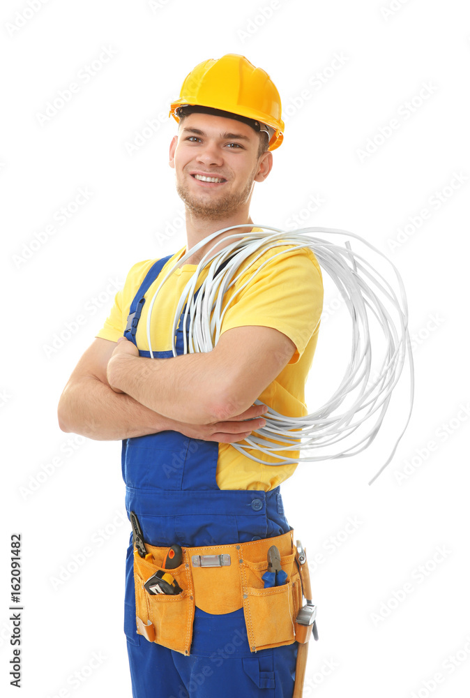 Wall mural young smiling electrician with bunch of wires on white background