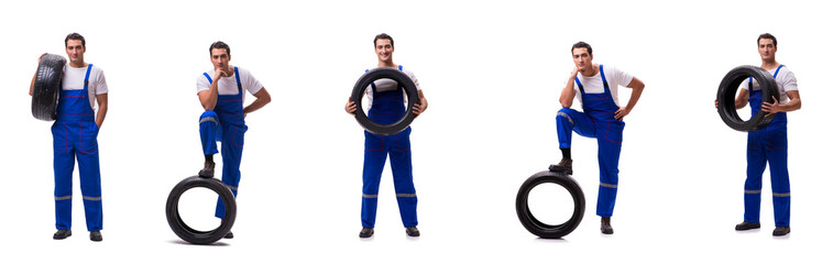 Handsome tyre repairman isolated on white © Elnur