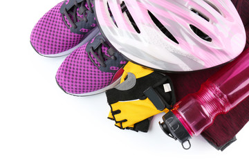 Bicycle accessories and biking clothes on white background